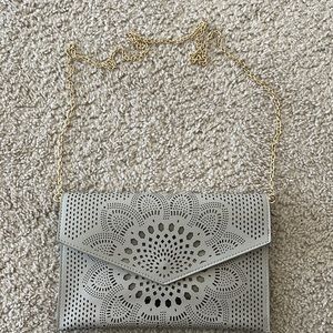 Never used adorable grey clutch/purse (removable gold strap)